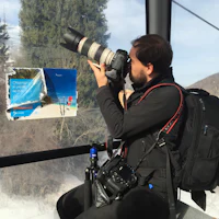 a man is taking a picture with a camera